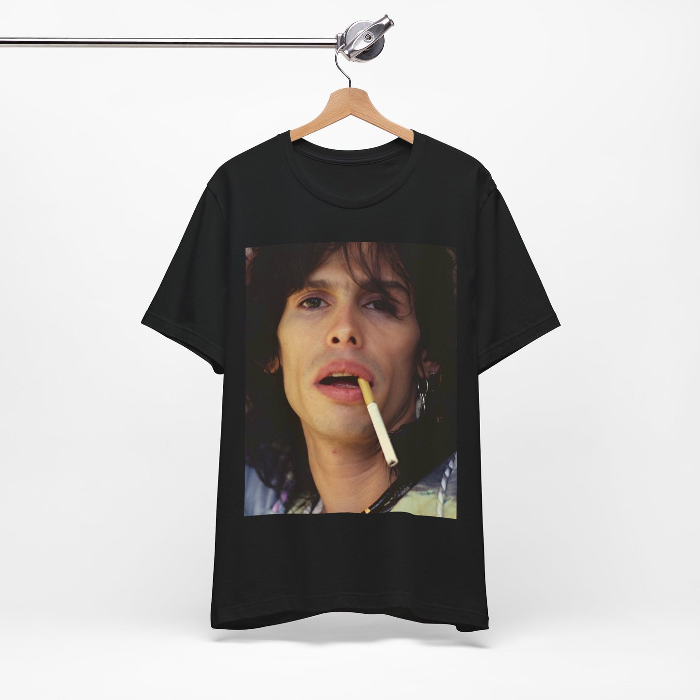 A black graphic t-shirt featuring a vintage 70s graphic design related to Aerosmith's 'Dream On' era, possibly with early band member imagery.