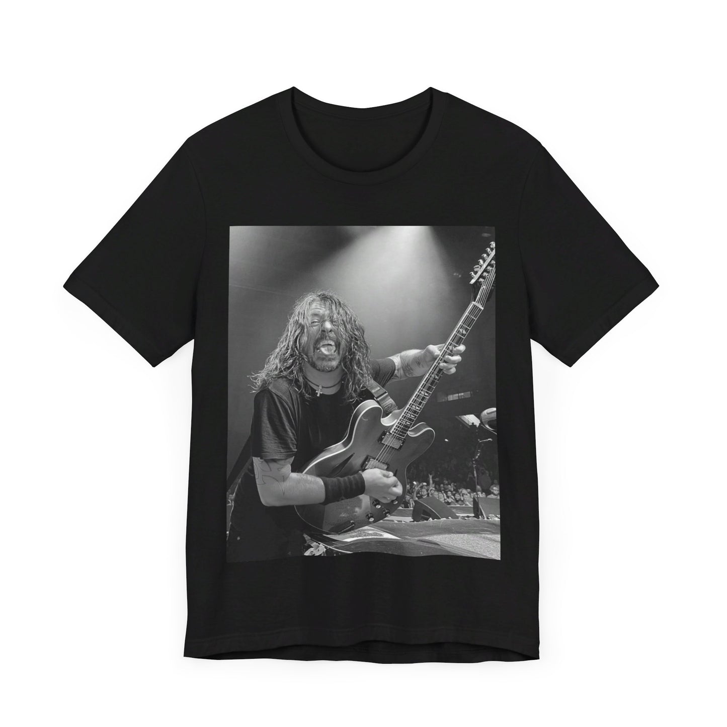 A black graphic t-shirt featuring a graphic of Dave Grohl from Foo Fighters playing guitar in concert.