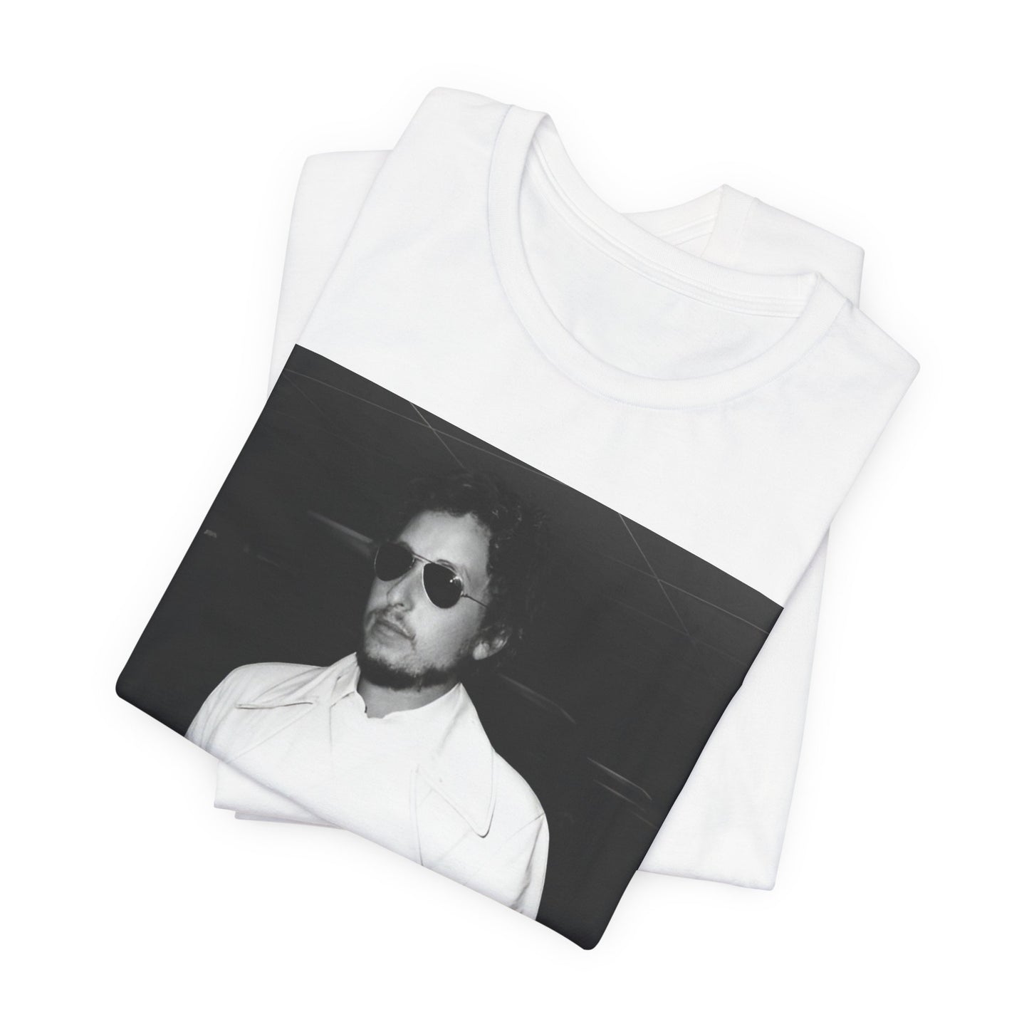 A black graphic t-shirt featuring a vintage black and white photo of Bob Dylan in a contemplative or iconic pose.