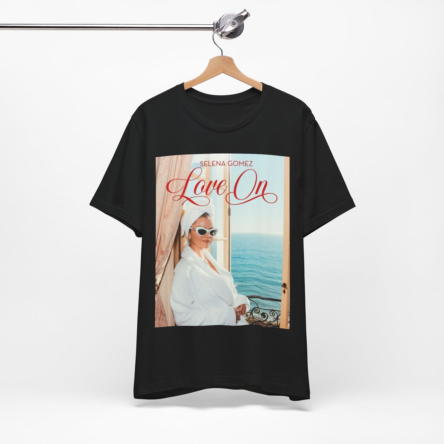 A black graphic t-shirt featuring a graphic related to Selena Gomez's 'Love On' song.