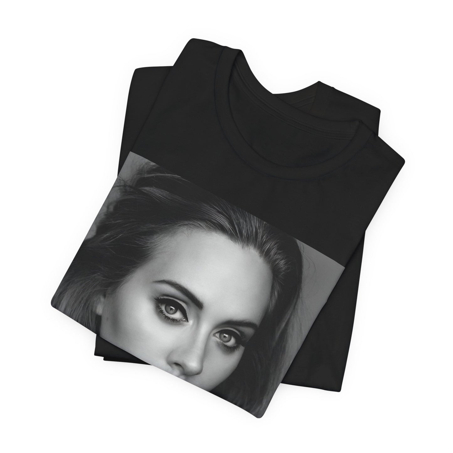 A black graphic t-shirt featuring a classic black and white, monochrome portrait of Adele, showing her with a serene or thoughtful expression.