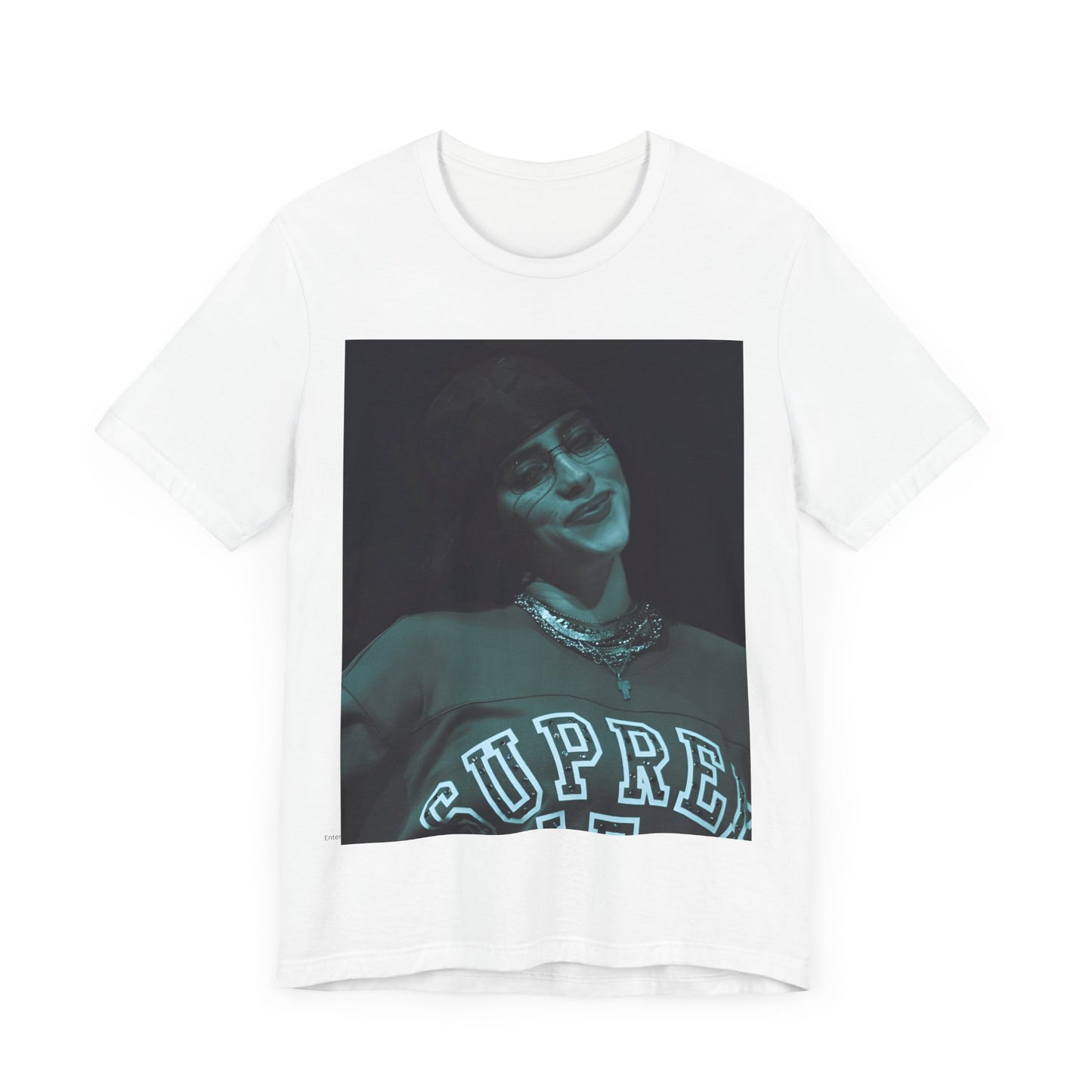 A powerful, close-up portrait of Billie Eilish with a direct and intense stare, printed on a graphic t-shirt.