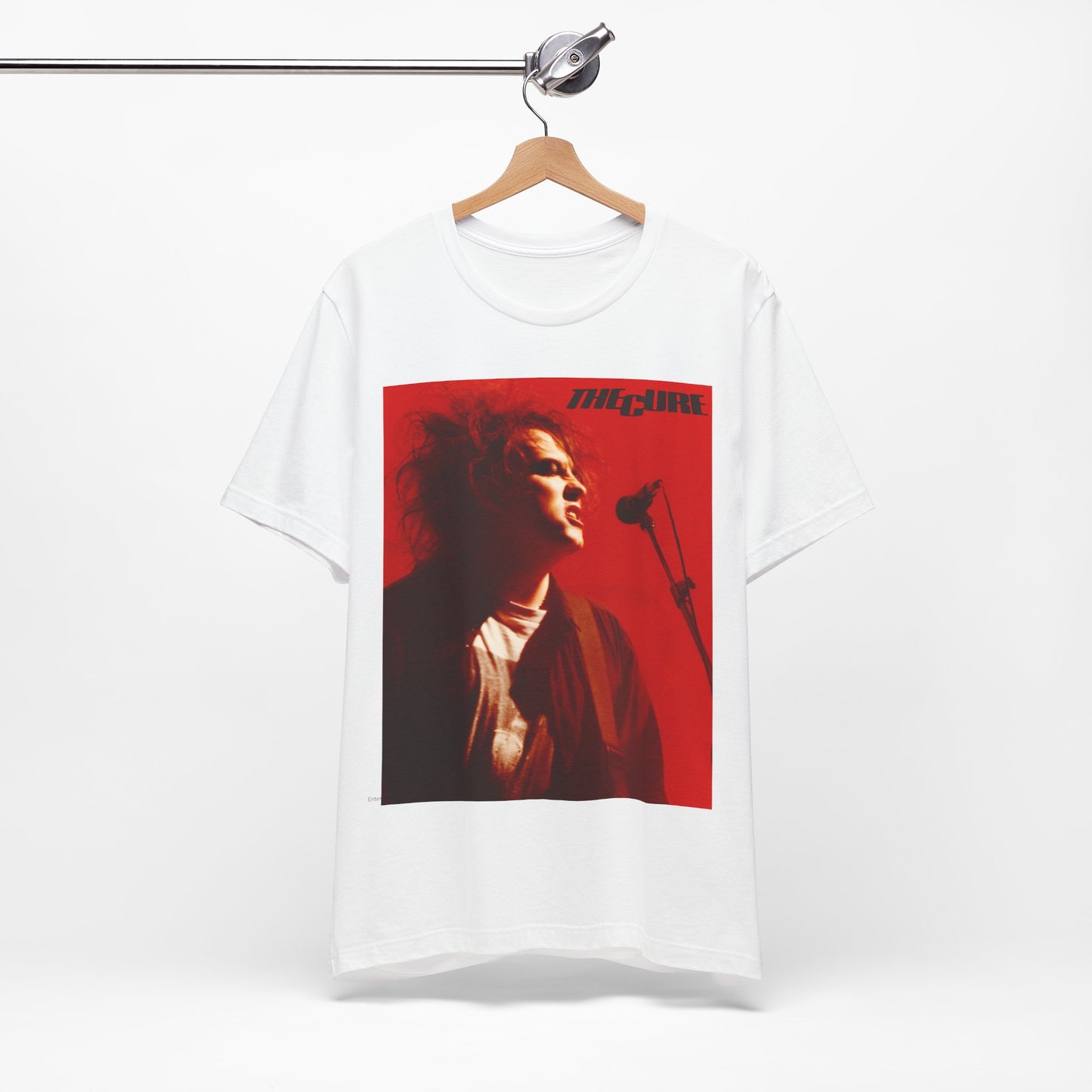 A black graphic t-shirt featuring a graphic of Robert Smith from The Cure with iconic red lipstick.