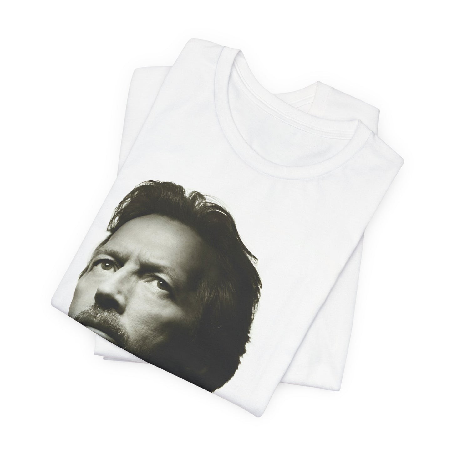 A black graphic t-shirt featuring a retro black and white portrait photo of Eric Clapton.