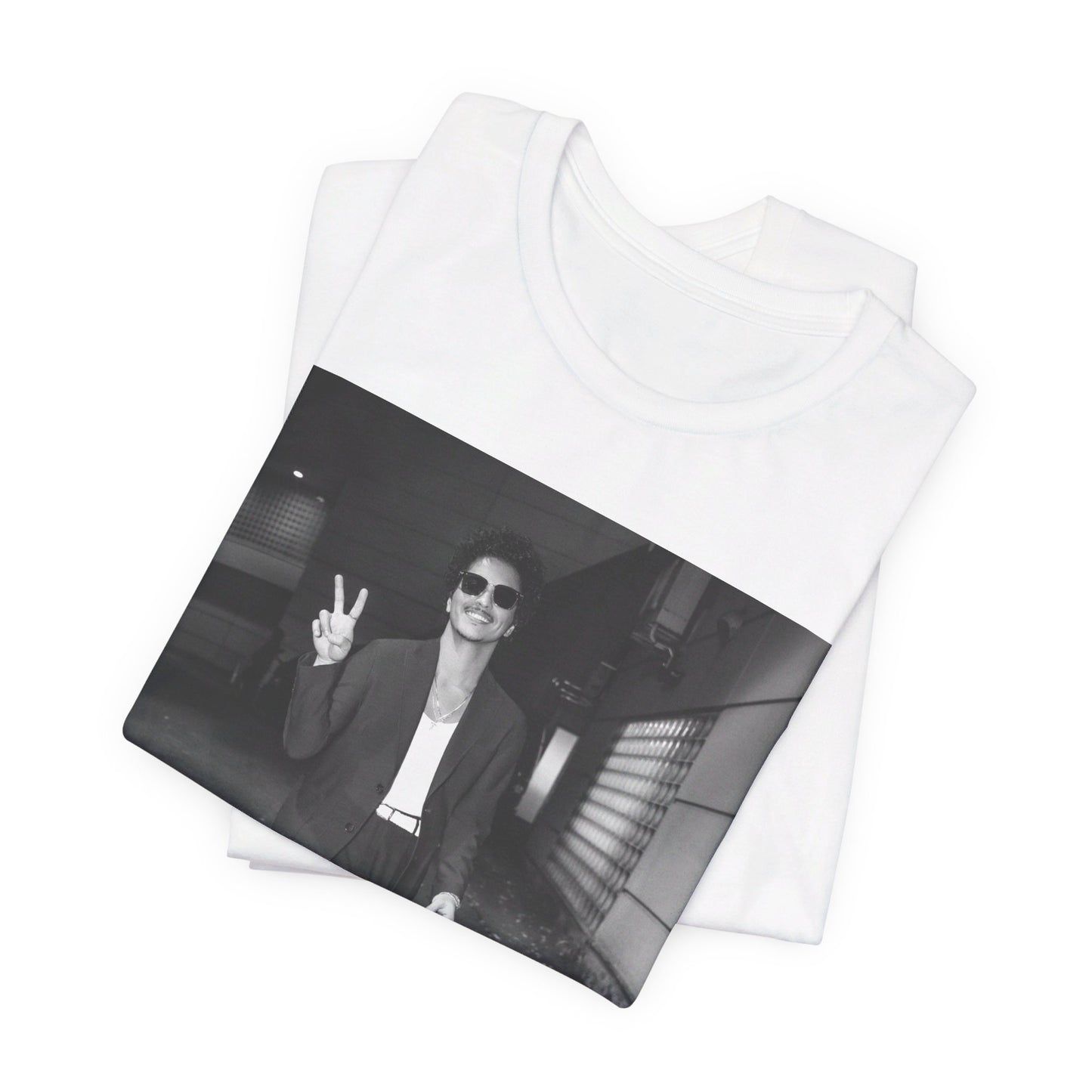 A black graphic t-shirt featuring a black and white graphic or photo of Bruno Mars in a backstage setting.