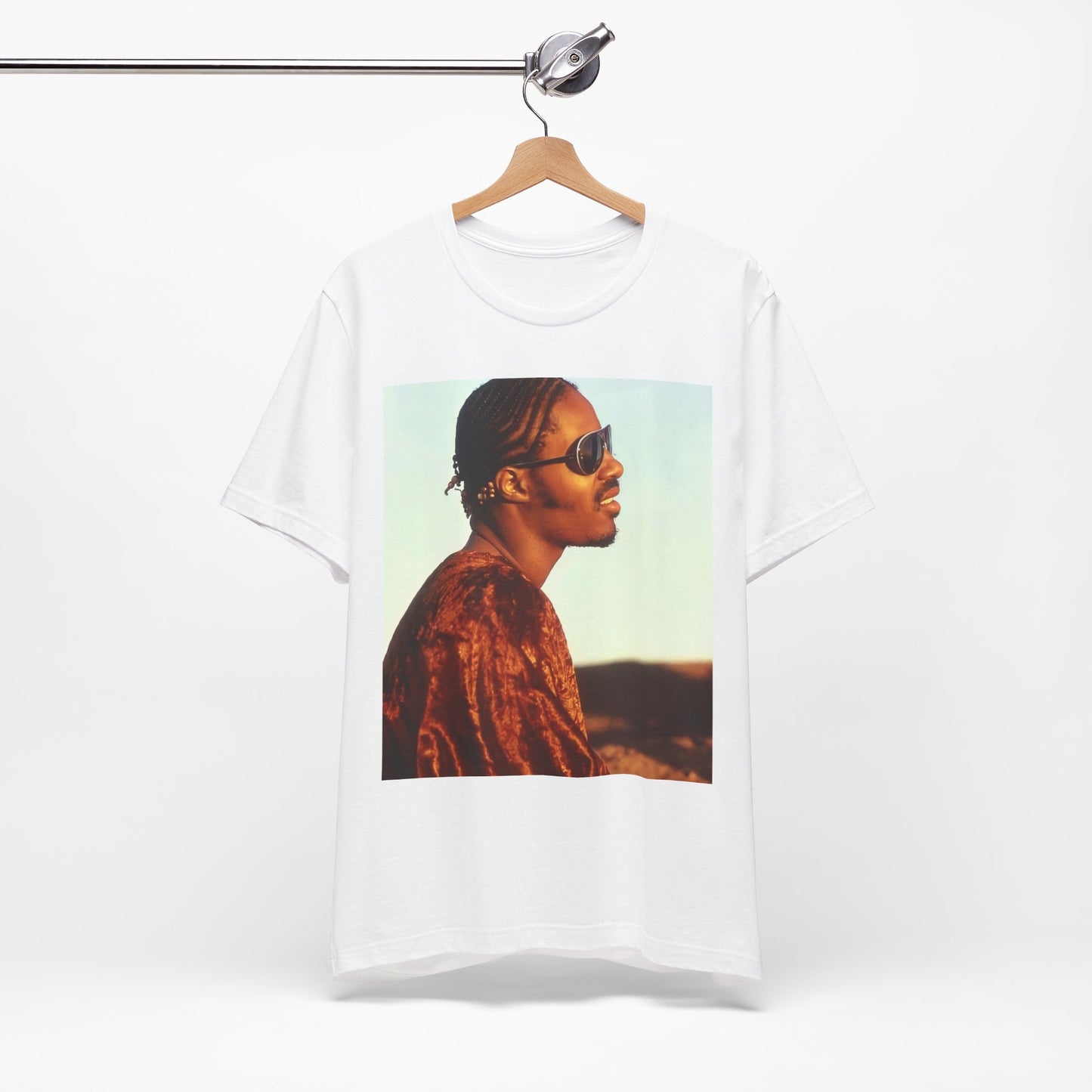 A black graphic t-shirt featuring a graphic of Stevie Wonder as an iconic style pop innovator.