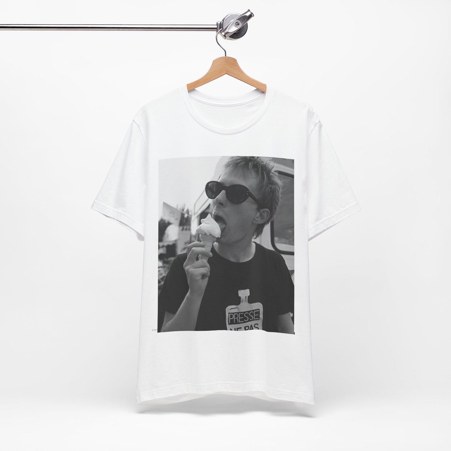 A black graphic t-shirt featuring a graphic of Thom Yorke from Radiohead with an ice cream cone.