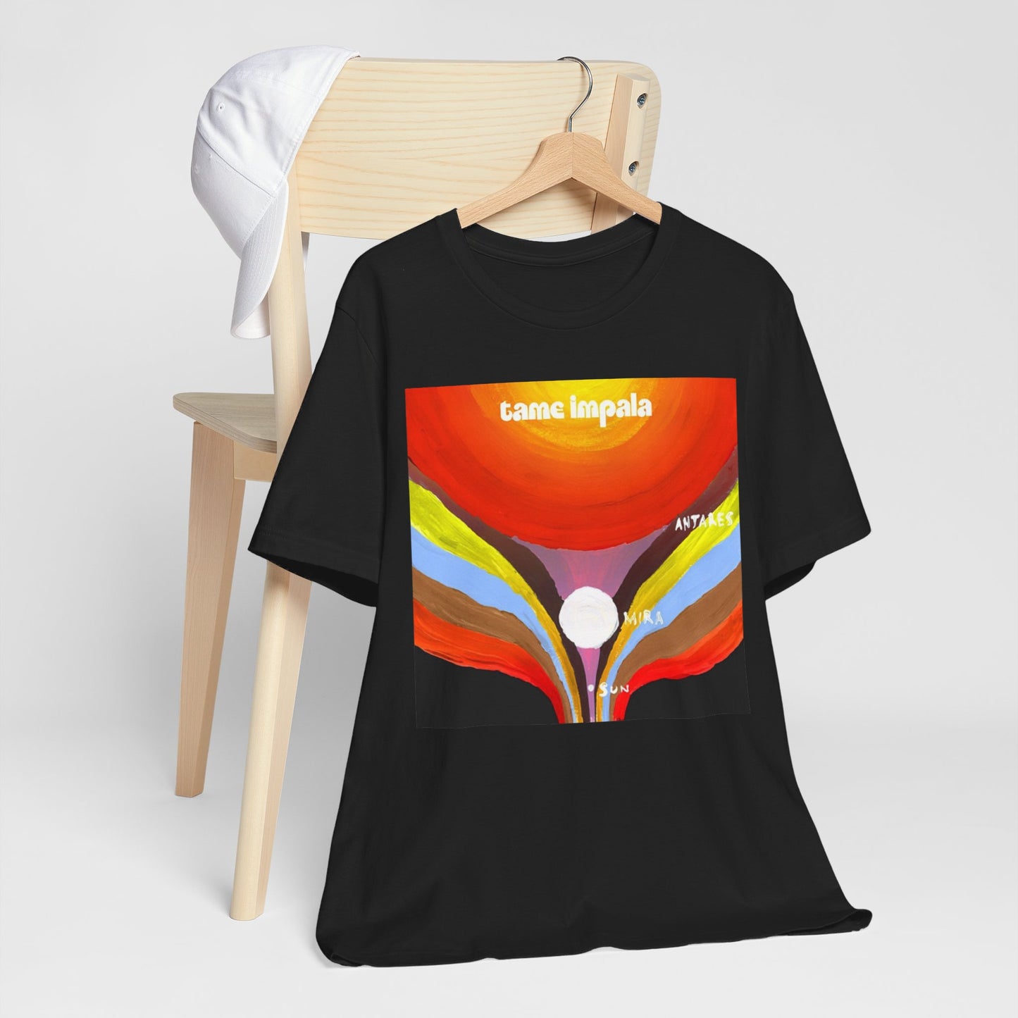 A black graphic t-shirt featuring a graphic inspired by Tame Impala's albums.