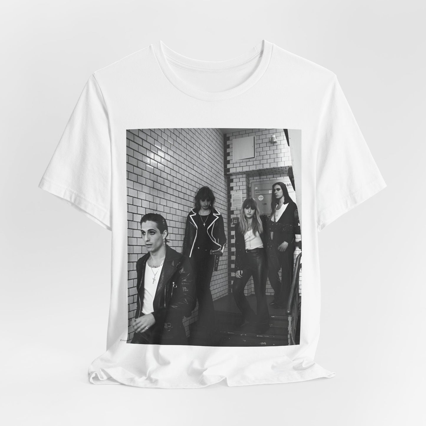 A black graphic t-shirt featuring a black and white graphic or photo of Maneskin in a backstage setting.