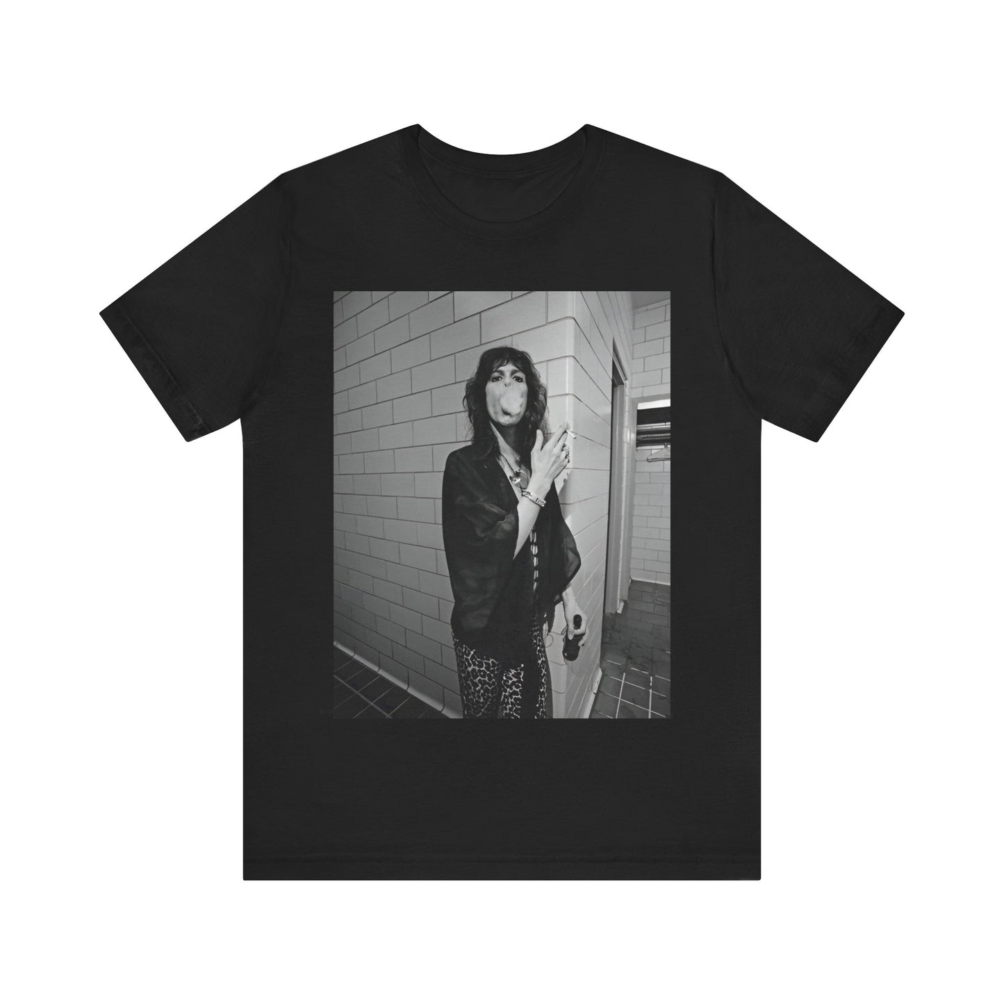 A black graphic t-shirt featuring a retro 70s photo of Aerosmith band members in a backstage setting, showing a candid moment.
