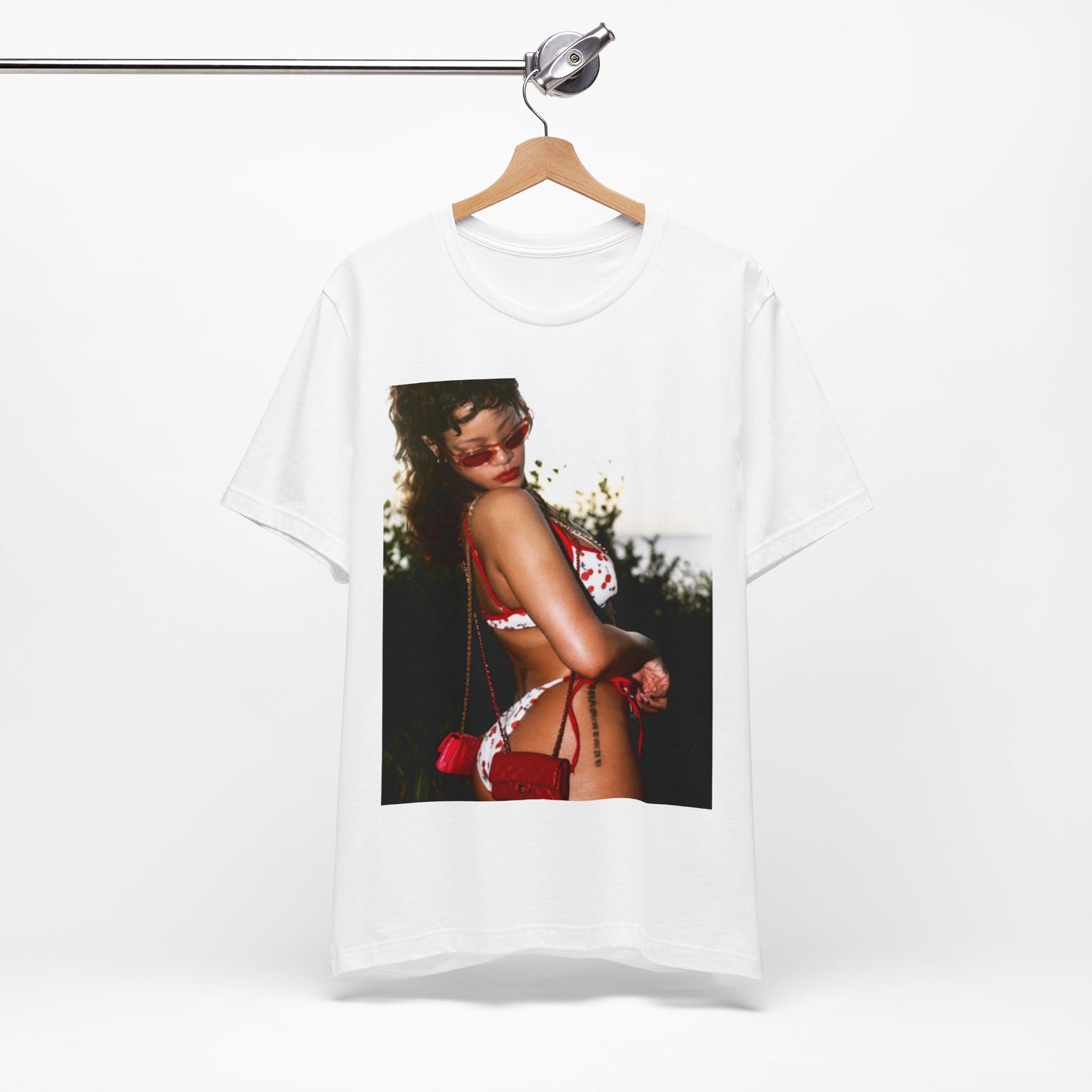 A black graphic t-shirt featuring a photo graphic of Rihanna in a bikini.
