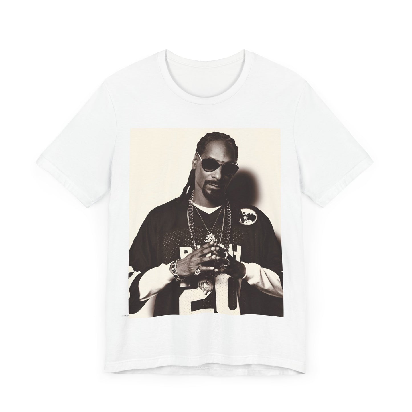A black graphic t-shirt featuring a black and white, monochrome graphic or photo of Snoop Dogg in an OG style.