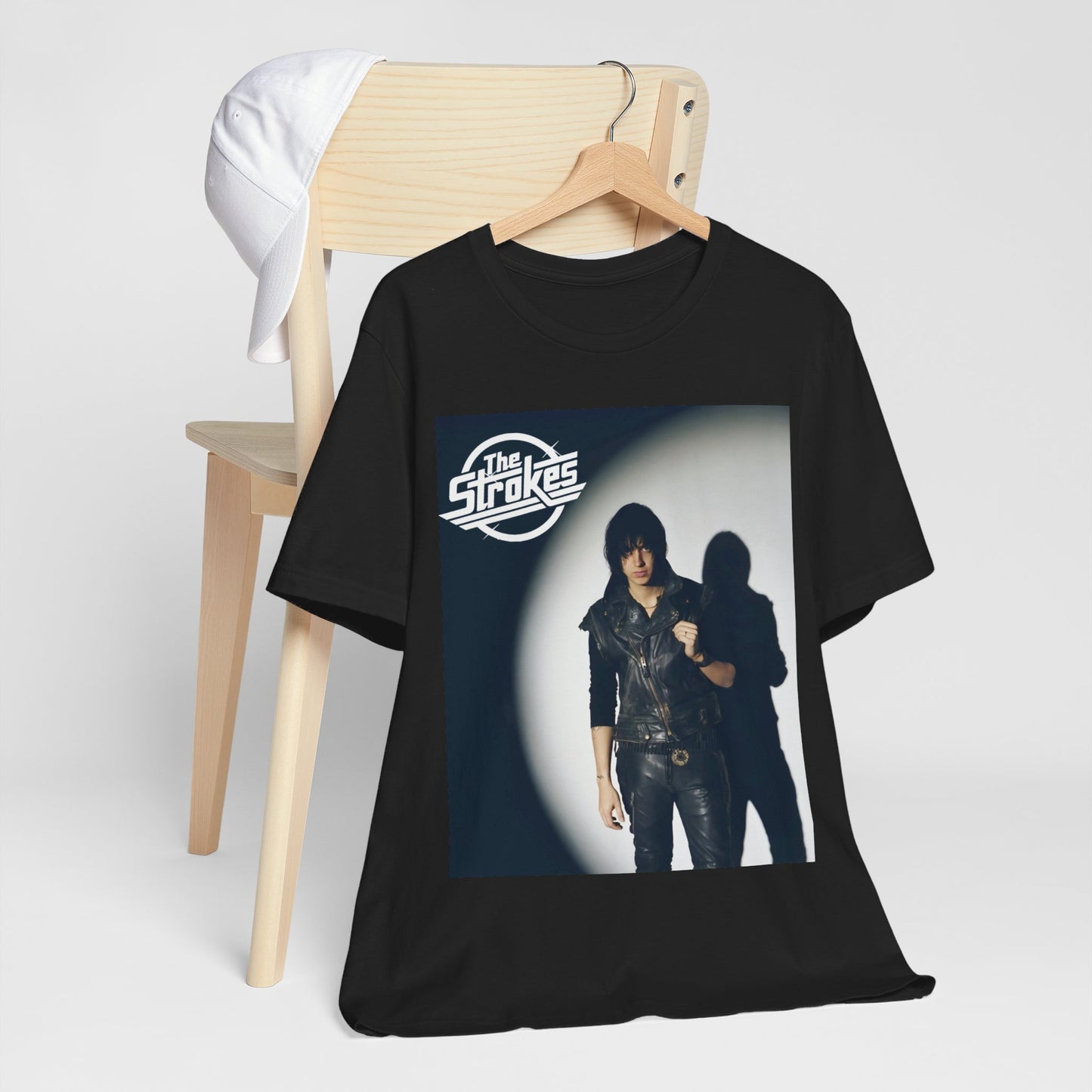 A black graphic t-shirt featuring a classic NYC garage rock graphic of The Strokes.