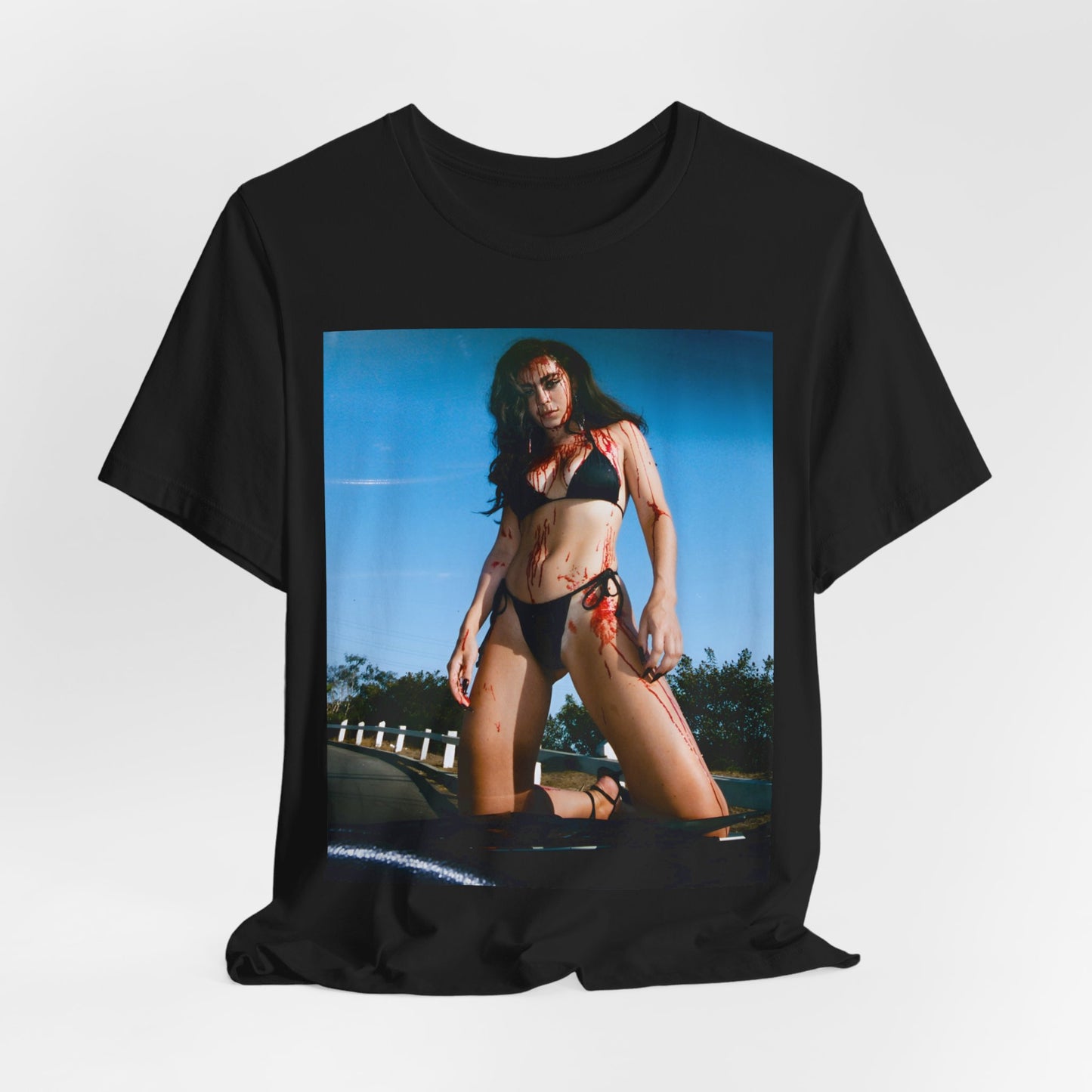 A black graphic t-shirt featuring the album cover art for Charli XCX's 'CRASH' album.