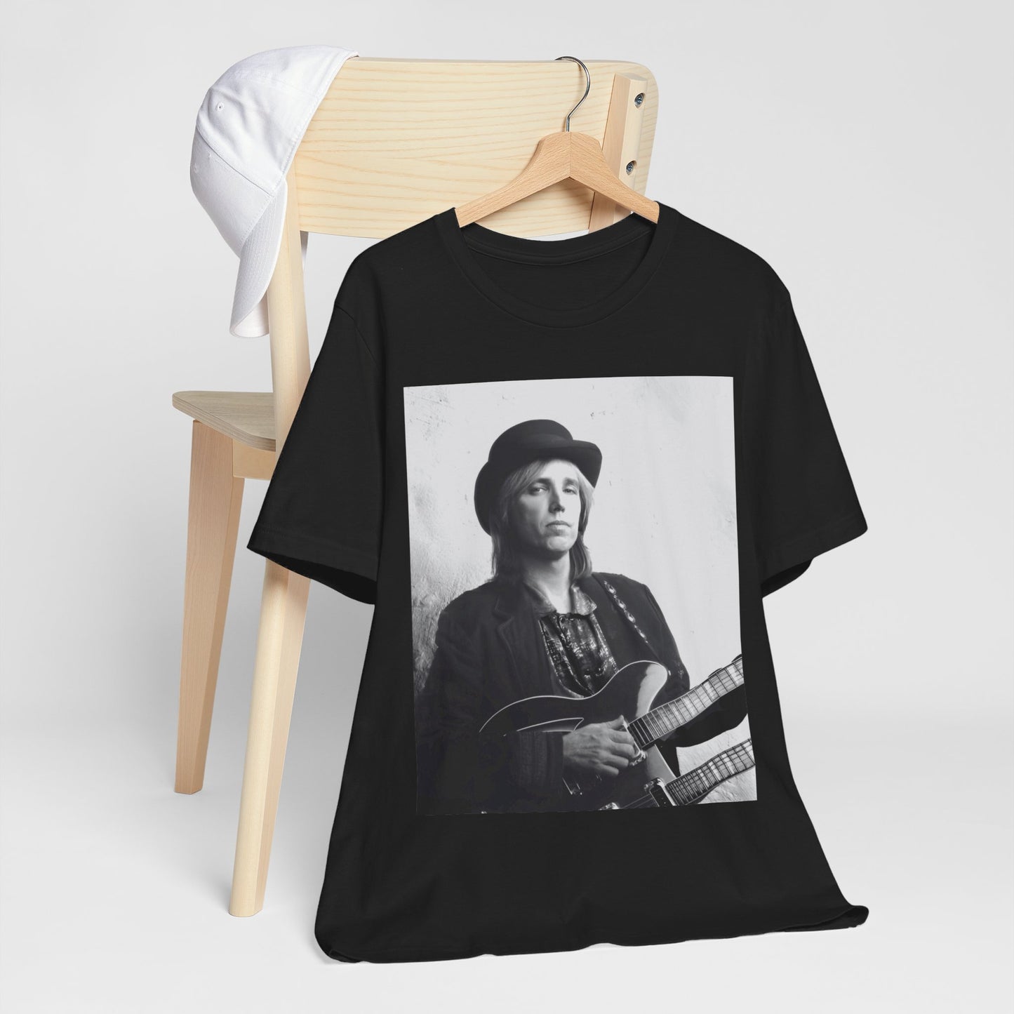 A black graphic t-shirt featuring a graphic related to Tom Petty's 'Wildflowers' album era.