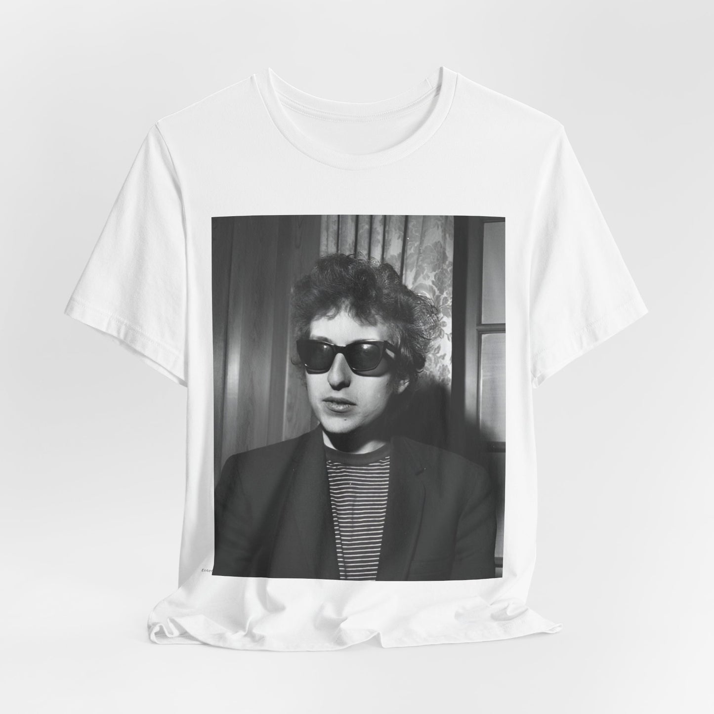 A black graphic t-shirt featuring a graphic related to Bob Dylan's 'The Freewheelin' album era.