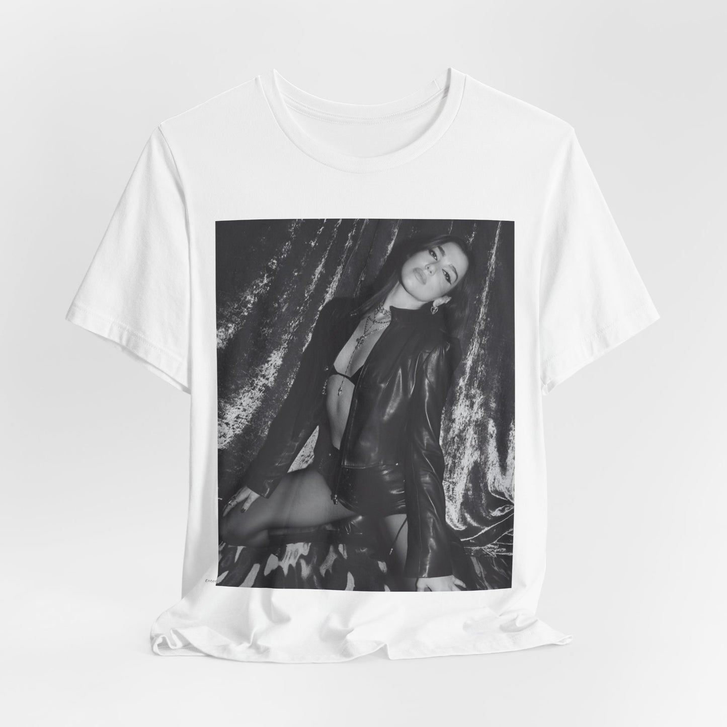 A black graphic t-shirt featuring a black and white portrait photo of Dua Lipa.