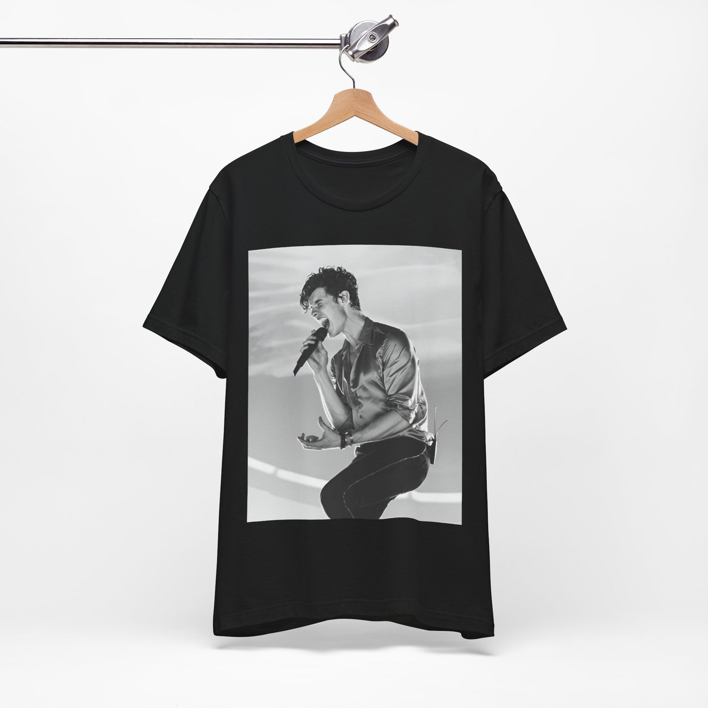 A black graphic t-shirt featuring a black and white graphic or photo of Shawn Mendes as a dreamy pop star.