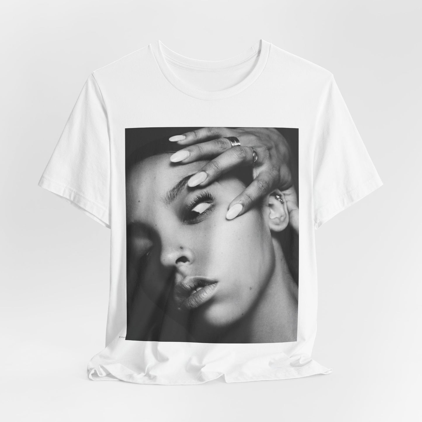 A black graphic t-shirt featuring a black and white, monochrome graphic or photo of Tinashe.