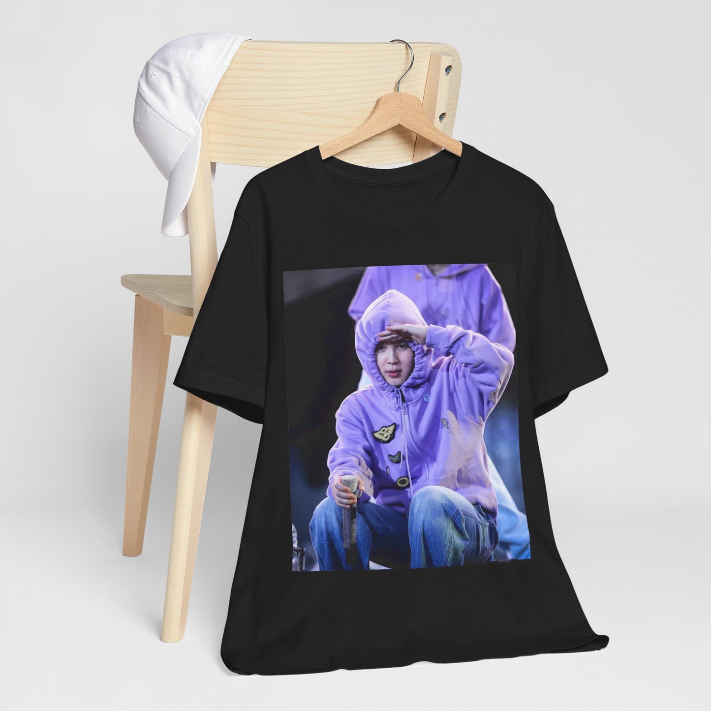 A black graphic t-shirt featuring an authentic live performance graphic of Jimin.