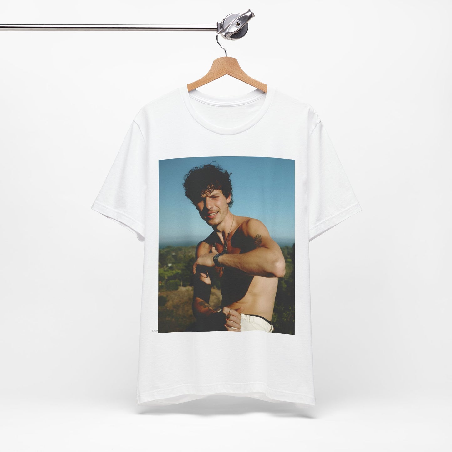 A black graphic t-shirt featuring a graphic of Shawn Mendes with a chill pop star look.