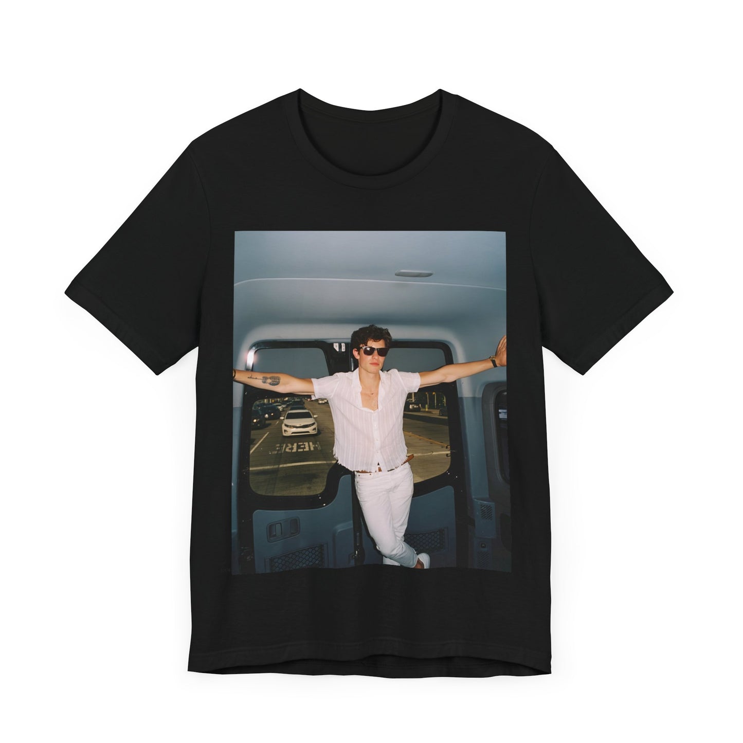 A black graphic t-shirt featuring a graphic of Shawn Mendes with a classic confident look.