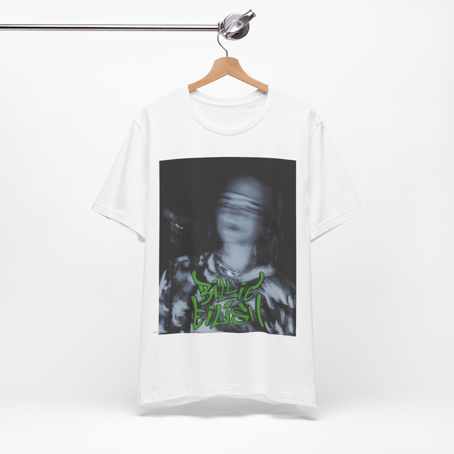 A photo of Billie Eilish in a classic 'anti-popstar' pose, with a bored expression and slouchy streetwear, printed on a graphic t-shirt.