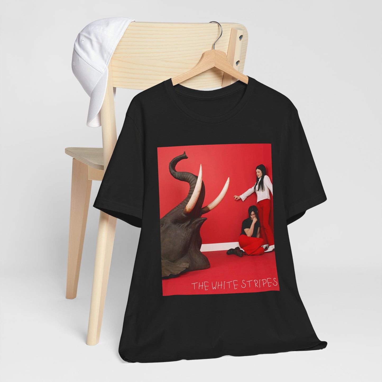 A black graphic t-shirt featuring a graphic related to The White Stripes' 'Elephant' album.