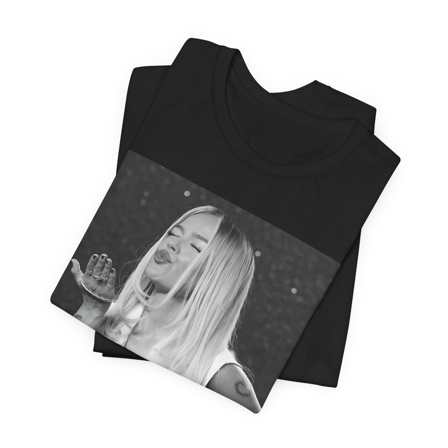 A black graphic t-shirt featuring a graphic of Karol G with a 'La Bichota Kiss' theme.