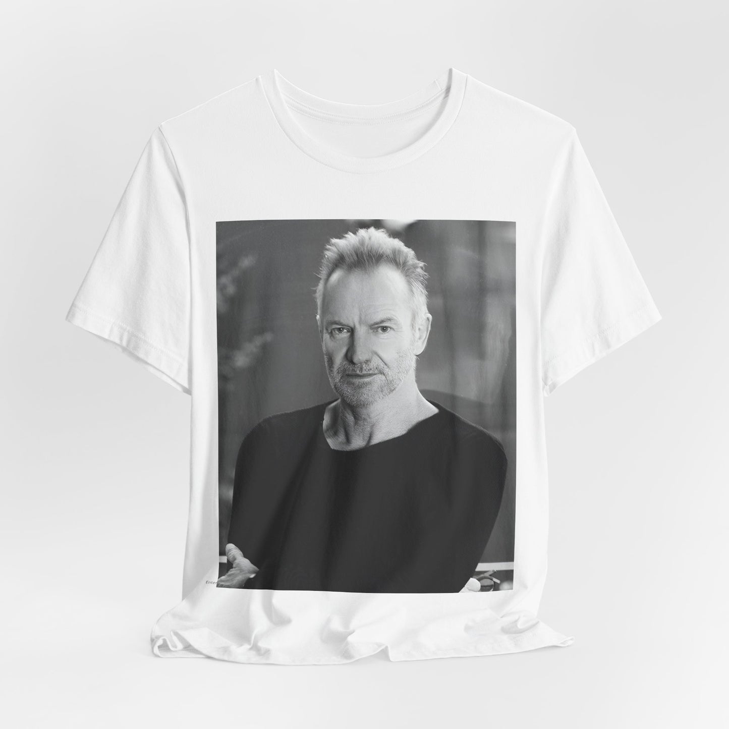 A black graphic t-shirt featuring a vintage graphic related to Sting's 'Desert Rose' song or era.