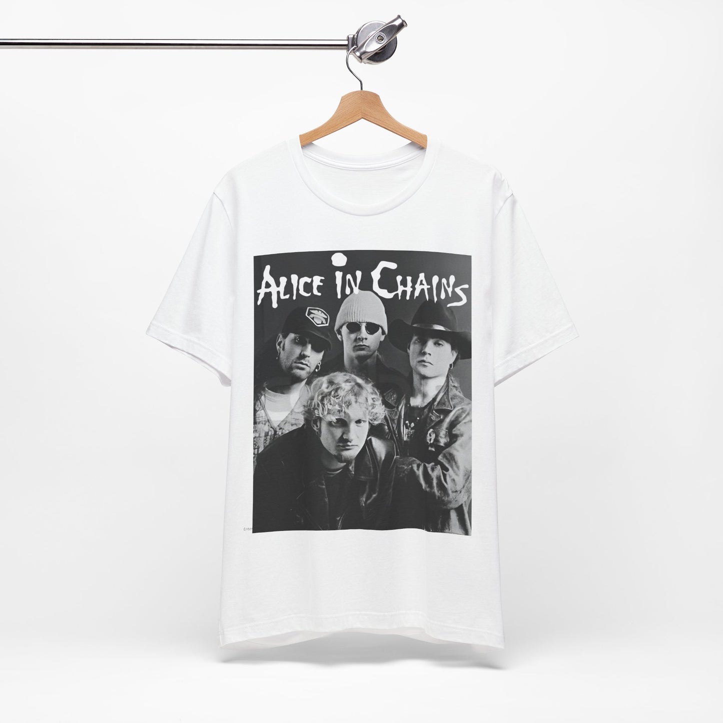A black graphic t-shirt featuring a black and white photographic portrait of the band Alice In Chains, capturing their iconic grunge look.