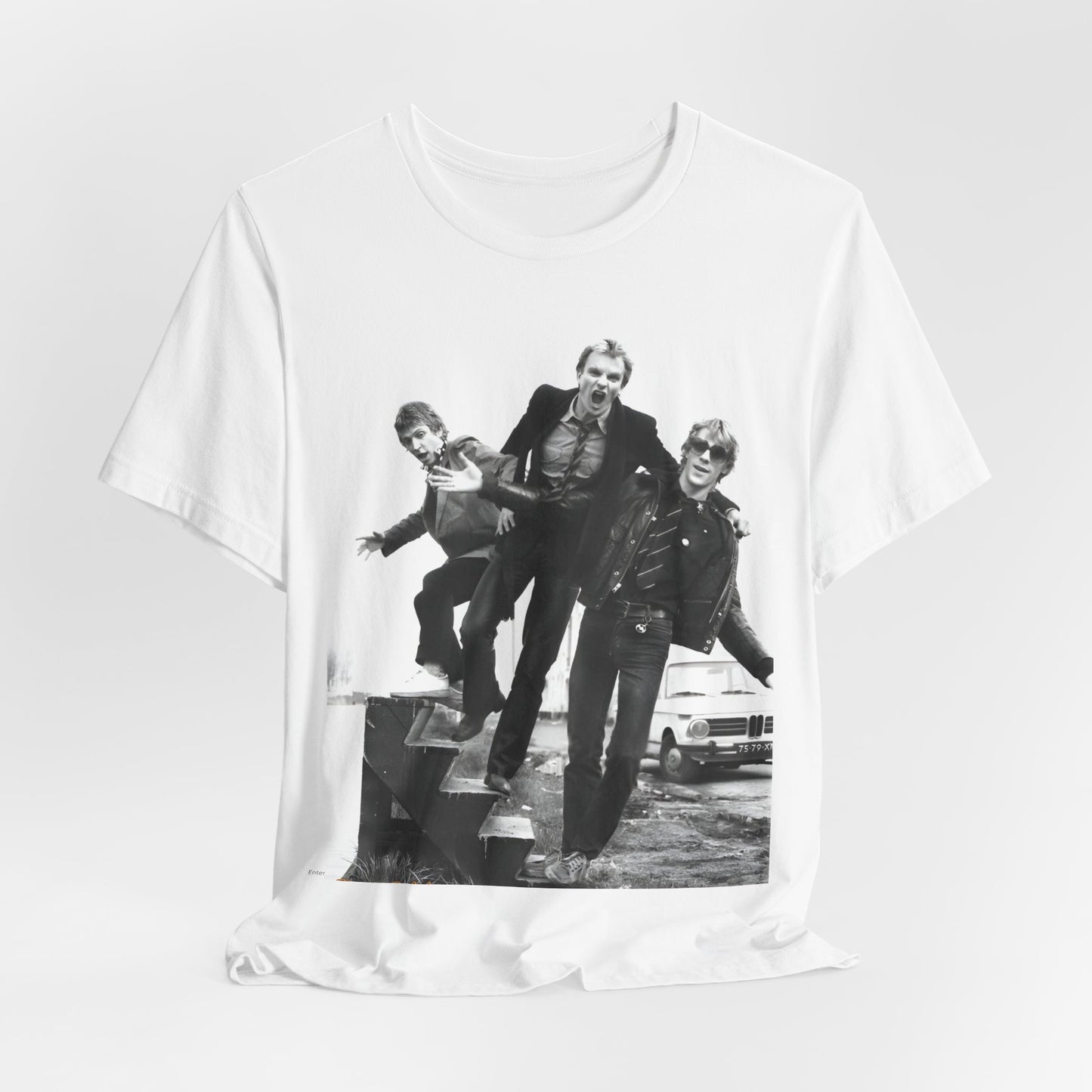 A black graphic t-shirt featuring an early days reggae rock graphic of The Police.