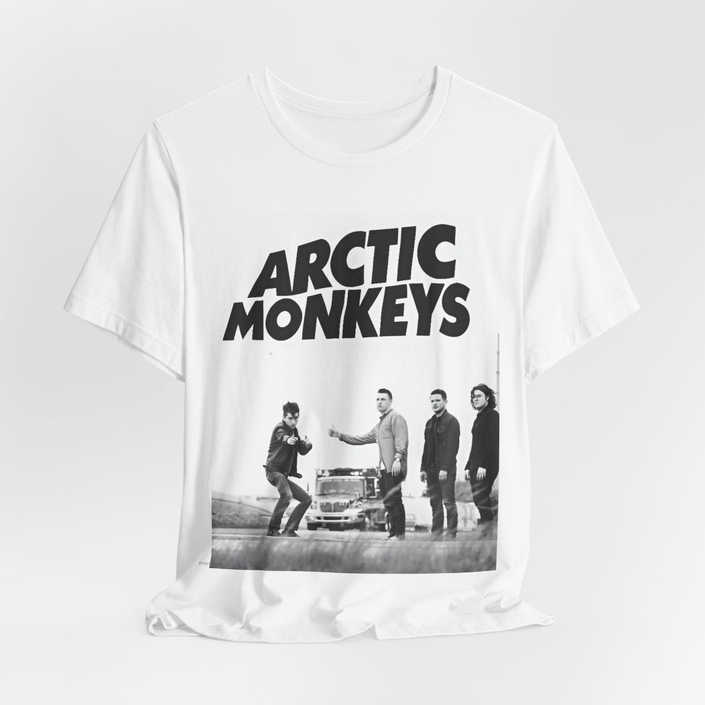 A black graphic t-shirt featuring the Arctic Monkeys logo in black and white.
