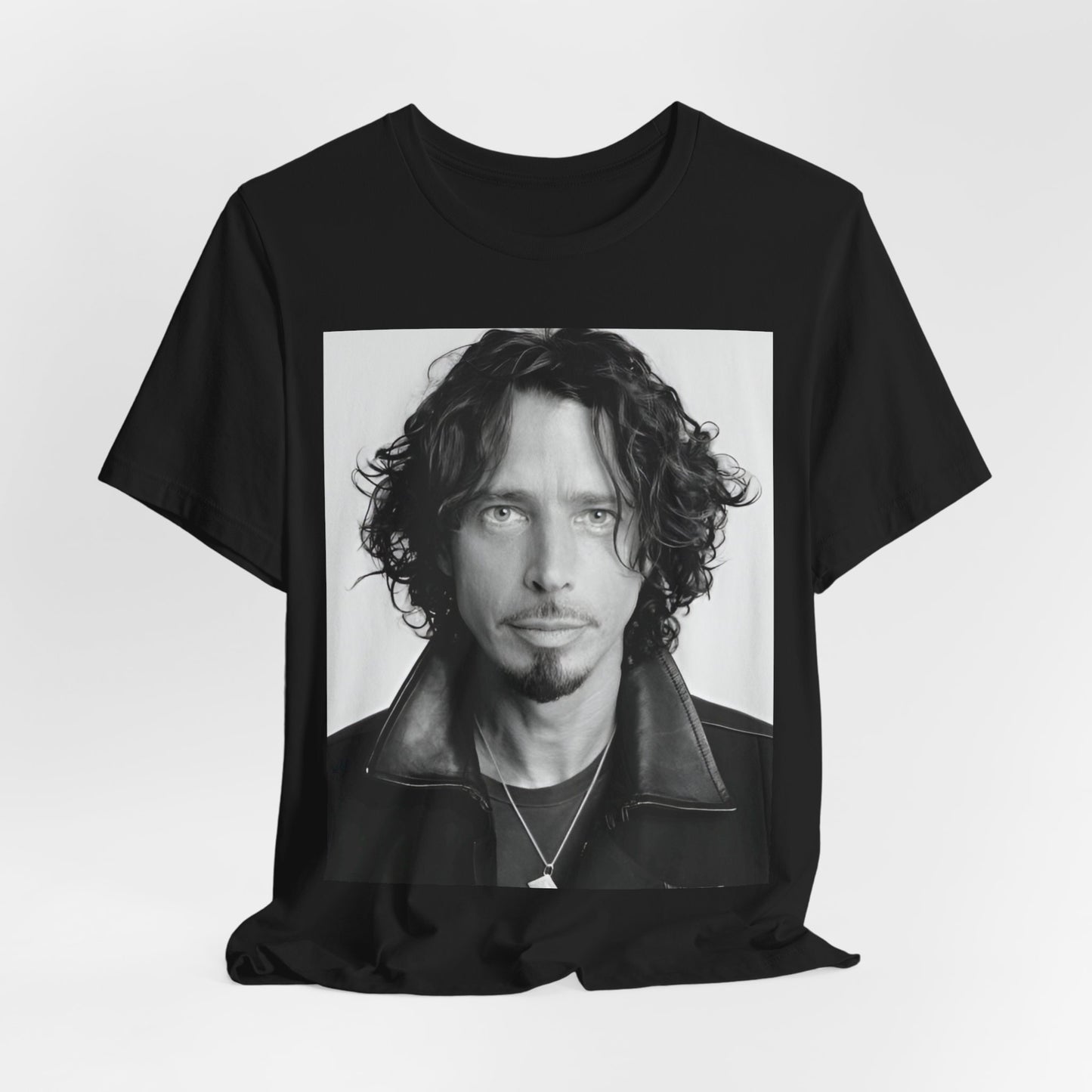 A black graphic t-shirt featuring a timeless black and white photo portrait of Chris Cornell.
