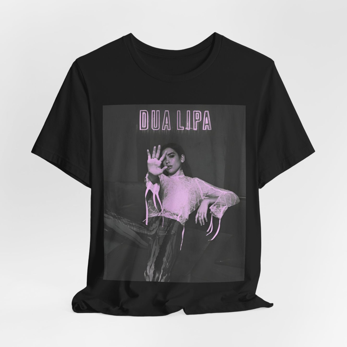 A black graphic t-shirt featuring a photo of Dua Lipa with a pink monochrome effect.