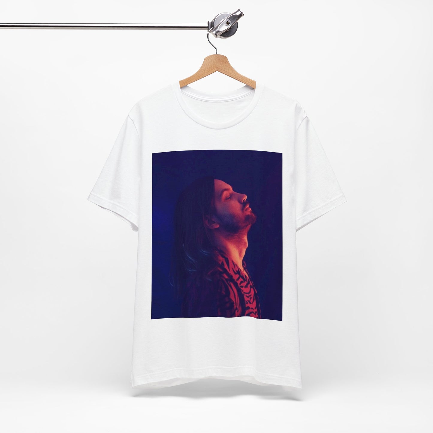 A black graphic t-shirt featuring a retro indie alt-rock graphic of Tame Impala.