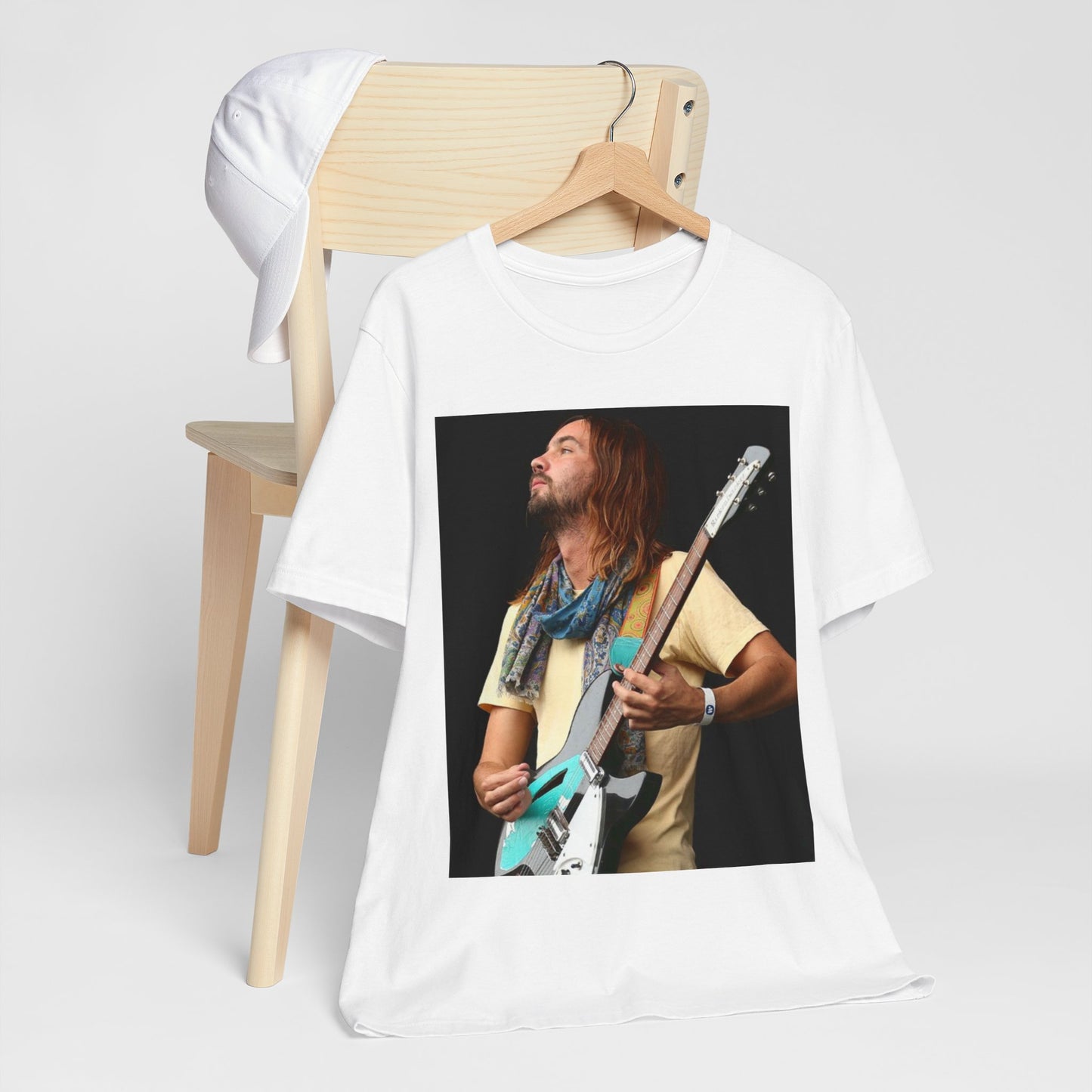 A black graphic t-shirt featuring a vintage indie rock graphic of Tame Impala.