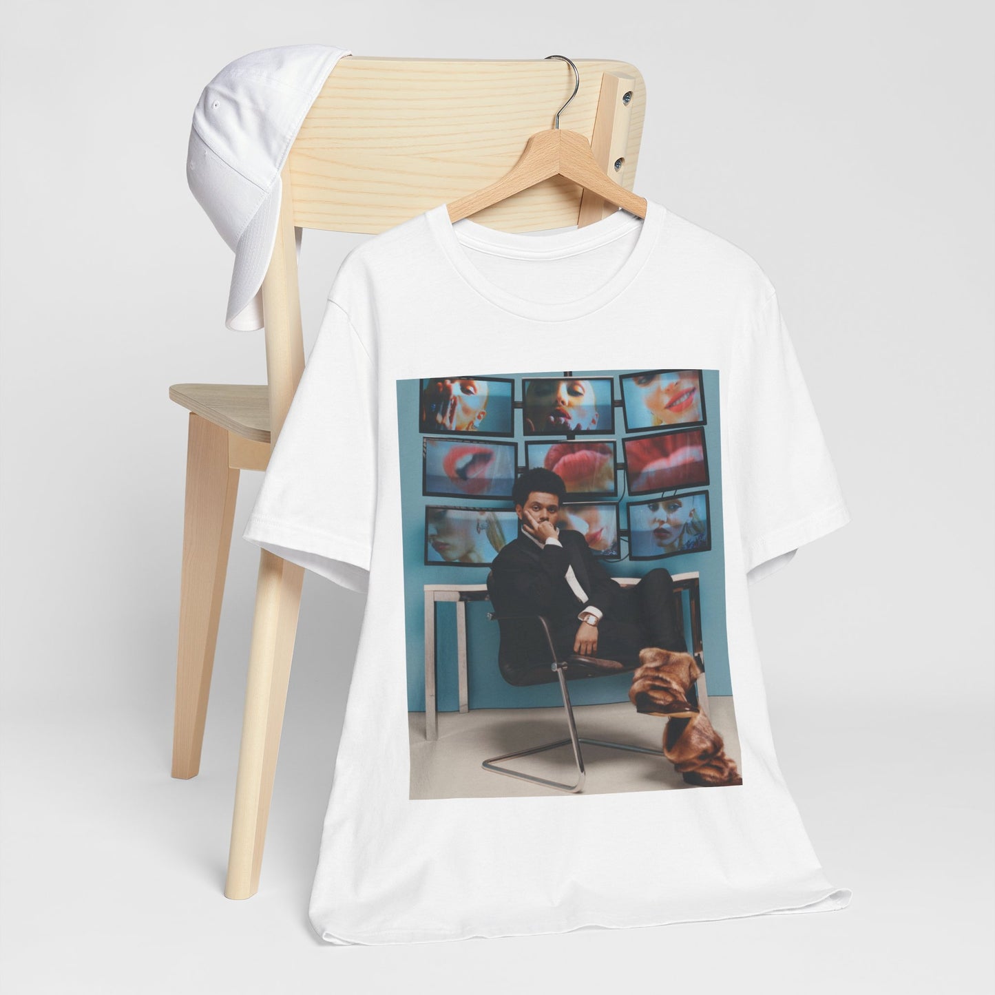 A black graphic t-shirt featuring an aesthetic graphic of The Weeknd.