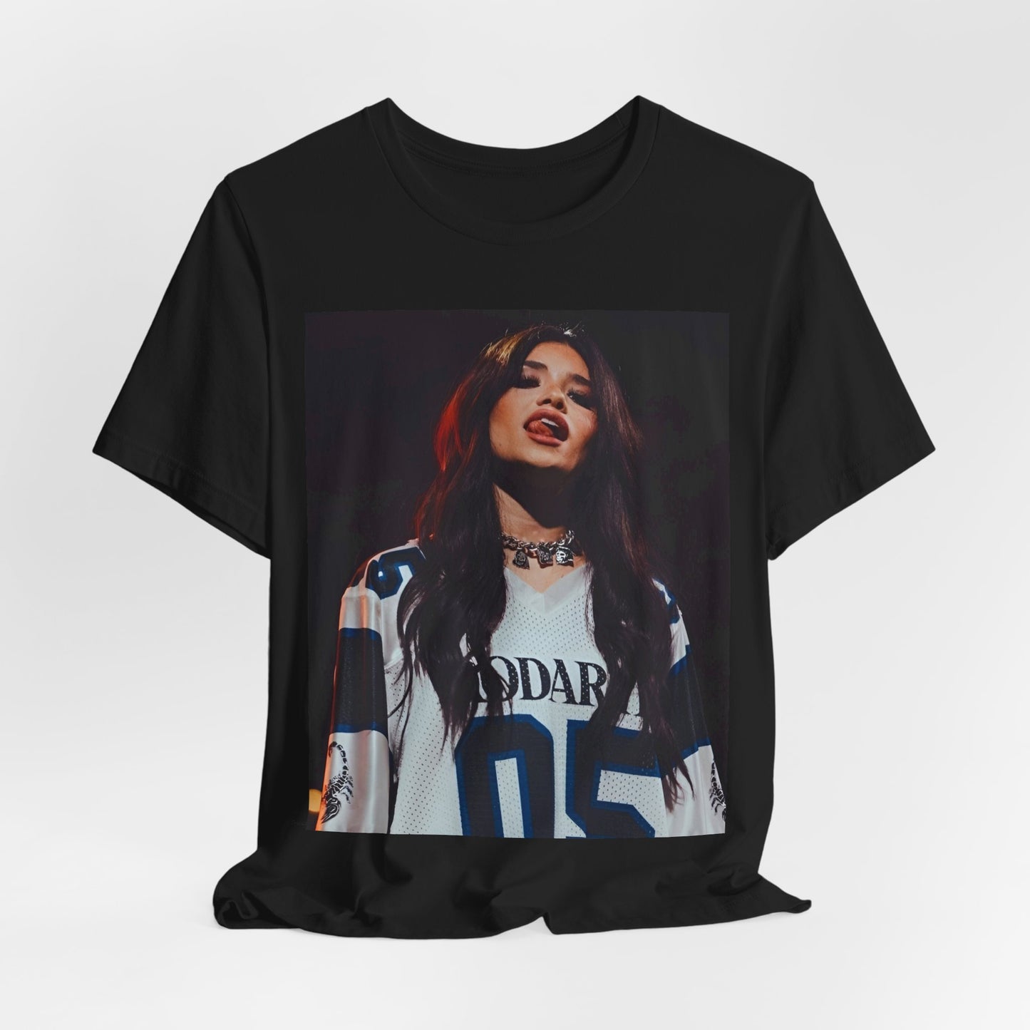 A black graphic t-shirt featuring a graphic or photo of Nessa Barrett performing live.