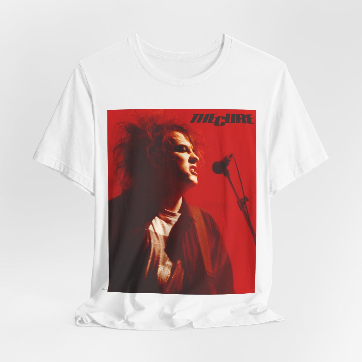 A black graphic t-shirt featuring a graphic of Robert Smith from The Cure with iconic red lipstick.