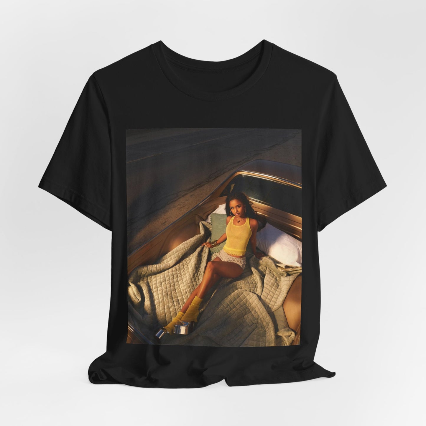 A black graphic t-shirt featuring a graphic of Tyla as an African fashion icon.