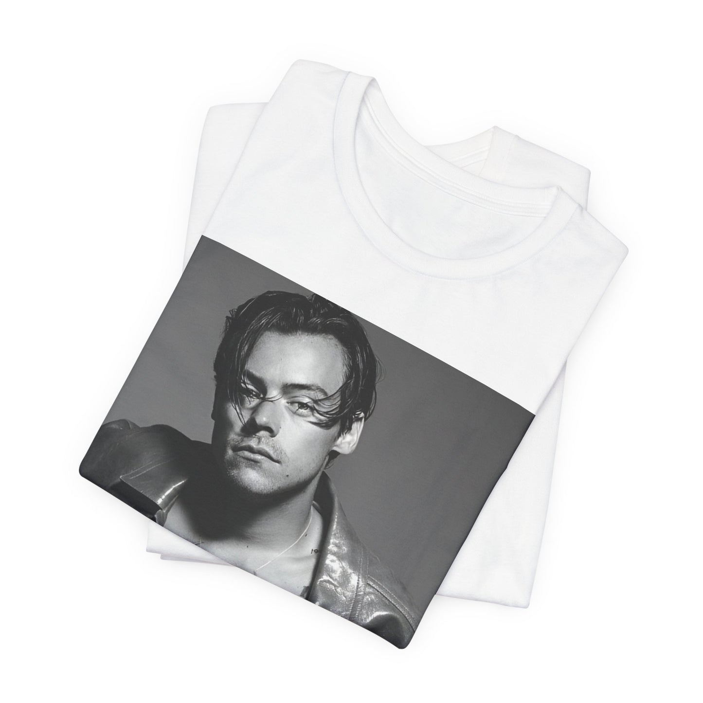 A black graphic t-shirt featuring a black and white portrait photo of Harry Styles.