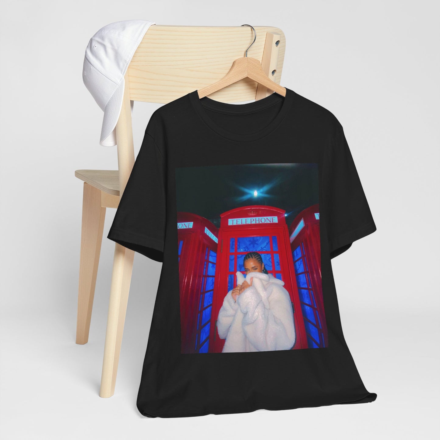 A black graphic t-shirt featuring a rhythmic dance pop graphic of Tyla.