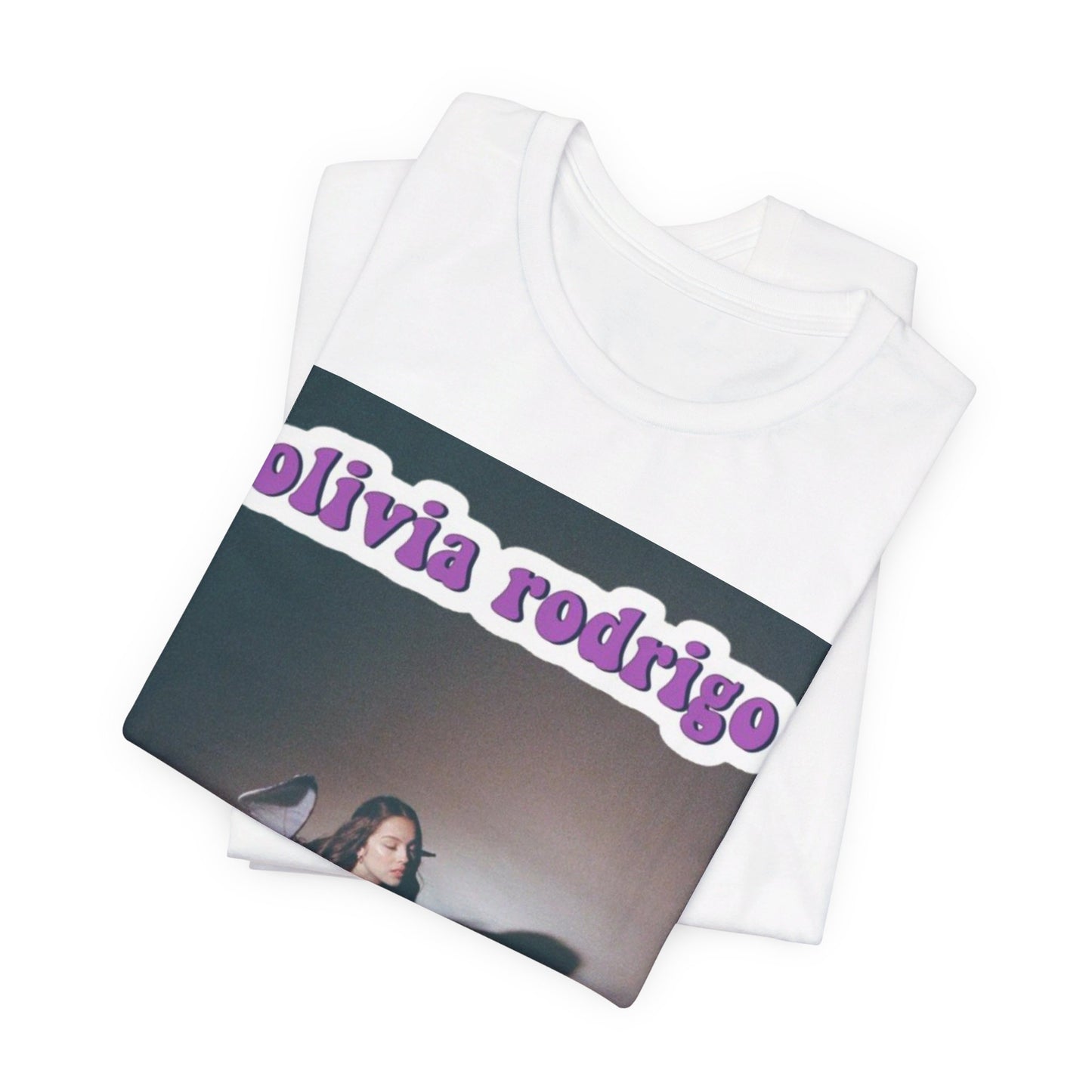 A black graphic t-shirt featuring a cool indie pop princess graphic of Olivia Rodrigo.