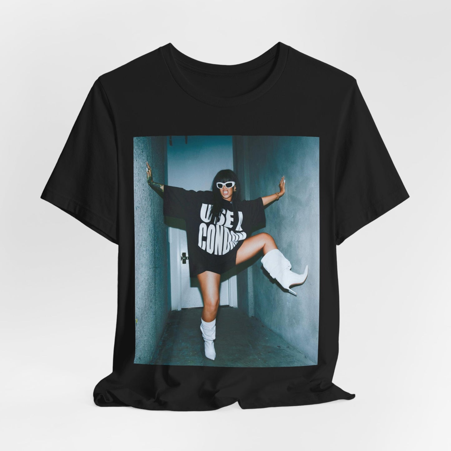A black graphic t-shirt featuring a modern pop essential graphic of Rihanna.