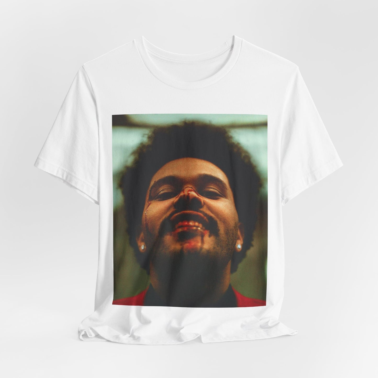 A black graphic t-shirt featuring the album cover art for The Weeknd's 'After Hours'.