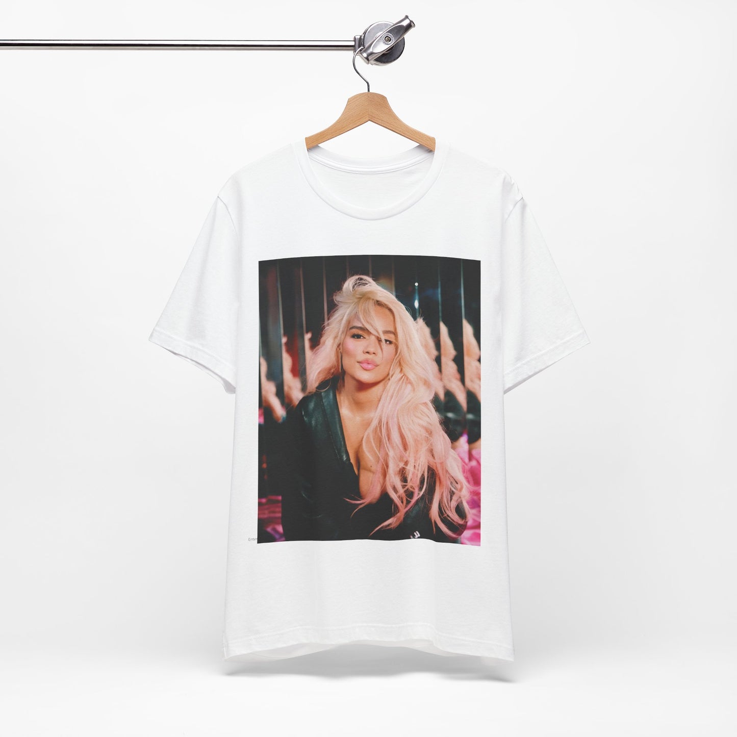 A black graphic t-shirt featuring a graphic of Karol G as an empowered Latina icon.