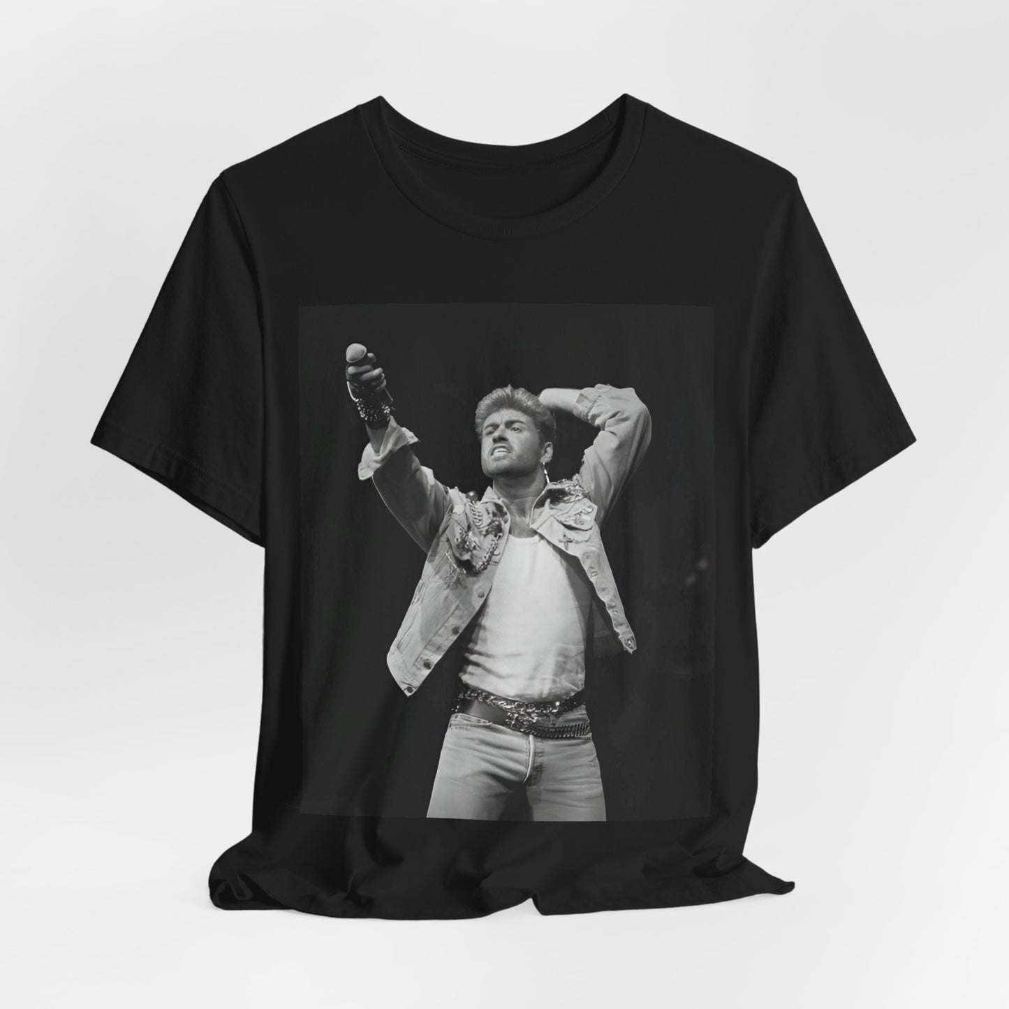 A black graphic t-shirt featuring a graphic or photo of George Michael performing live on stage.