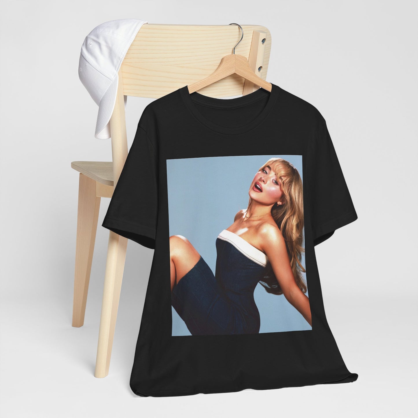 A black graphic t-shirt featuring a graphic related to Sabrina Carpenter's 'Espresso' song or era.