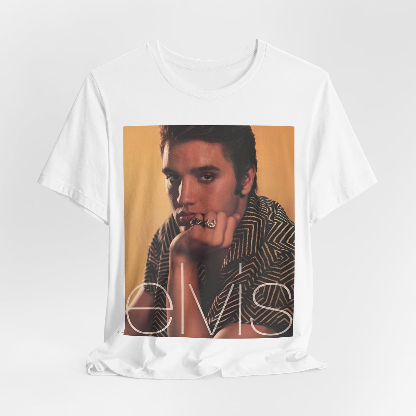 A black graphic t-shirt featuring an aesthetic photo portrait of Elvis Presley.